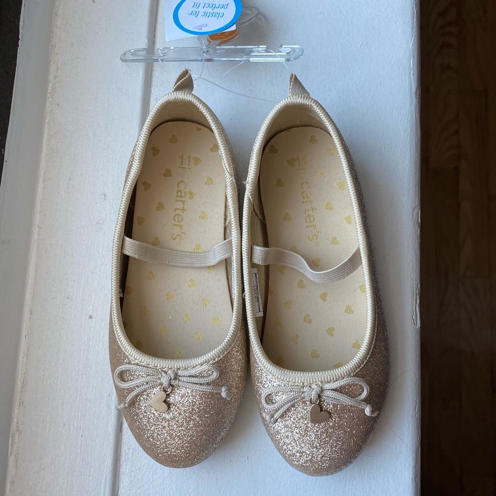 Carter’s girl’s gold party shoes.